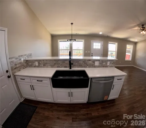 a kitchen with a sink and cabinets