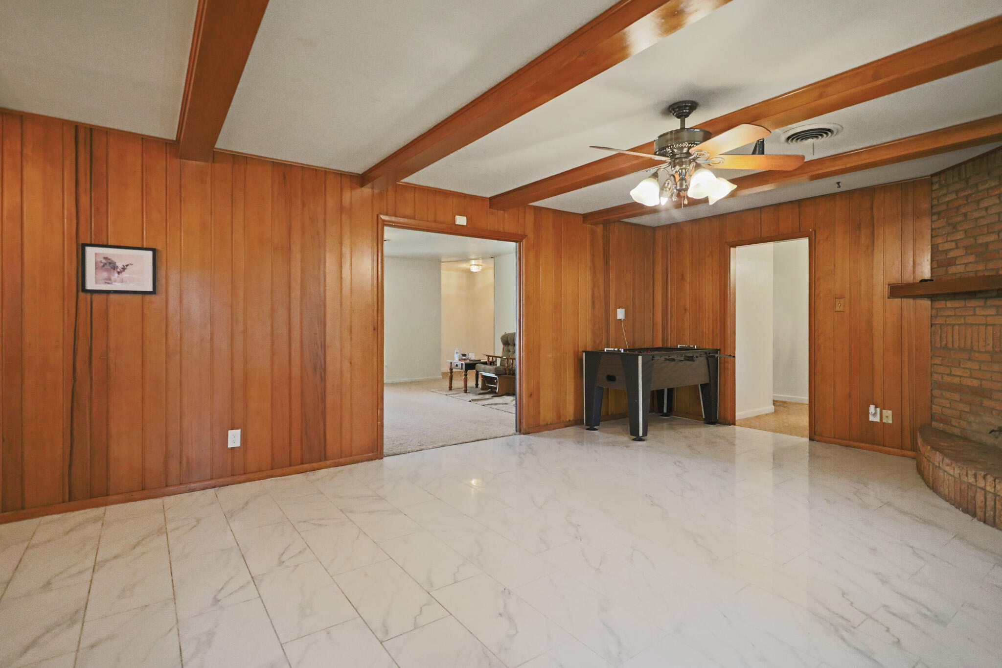 5209 17th Street Lubbock, TX 79416 - Photo 12 of 40 a view of a livingroom with furniture and a ceiling fan