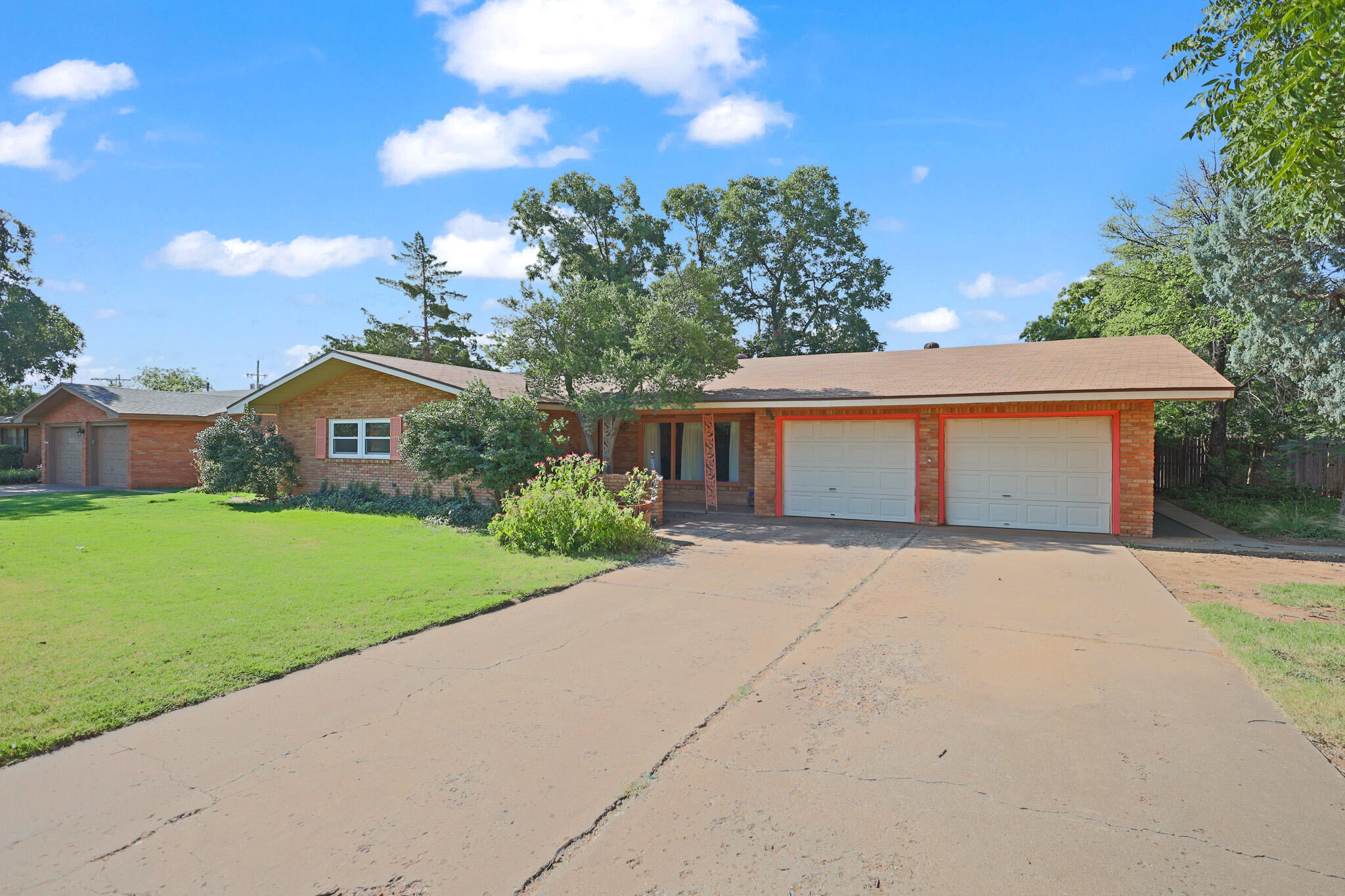 5209 17th Street Lubbock, TX 79416 - Photo 2 of 40 a front view of house with yard and green space