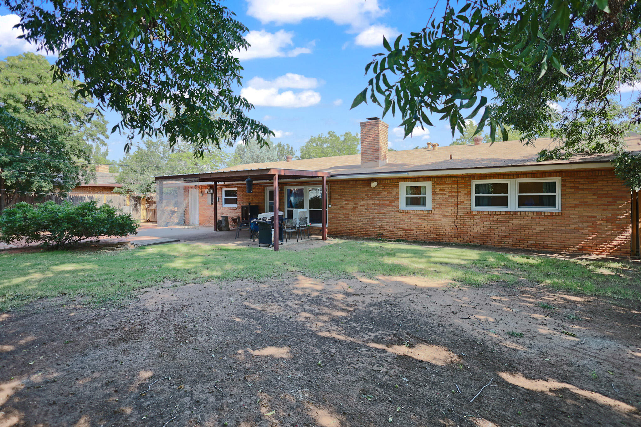 5209 17th Street Lubbock, TX 79416 - Photo 34 of 40 a view of a house with yard and tree s