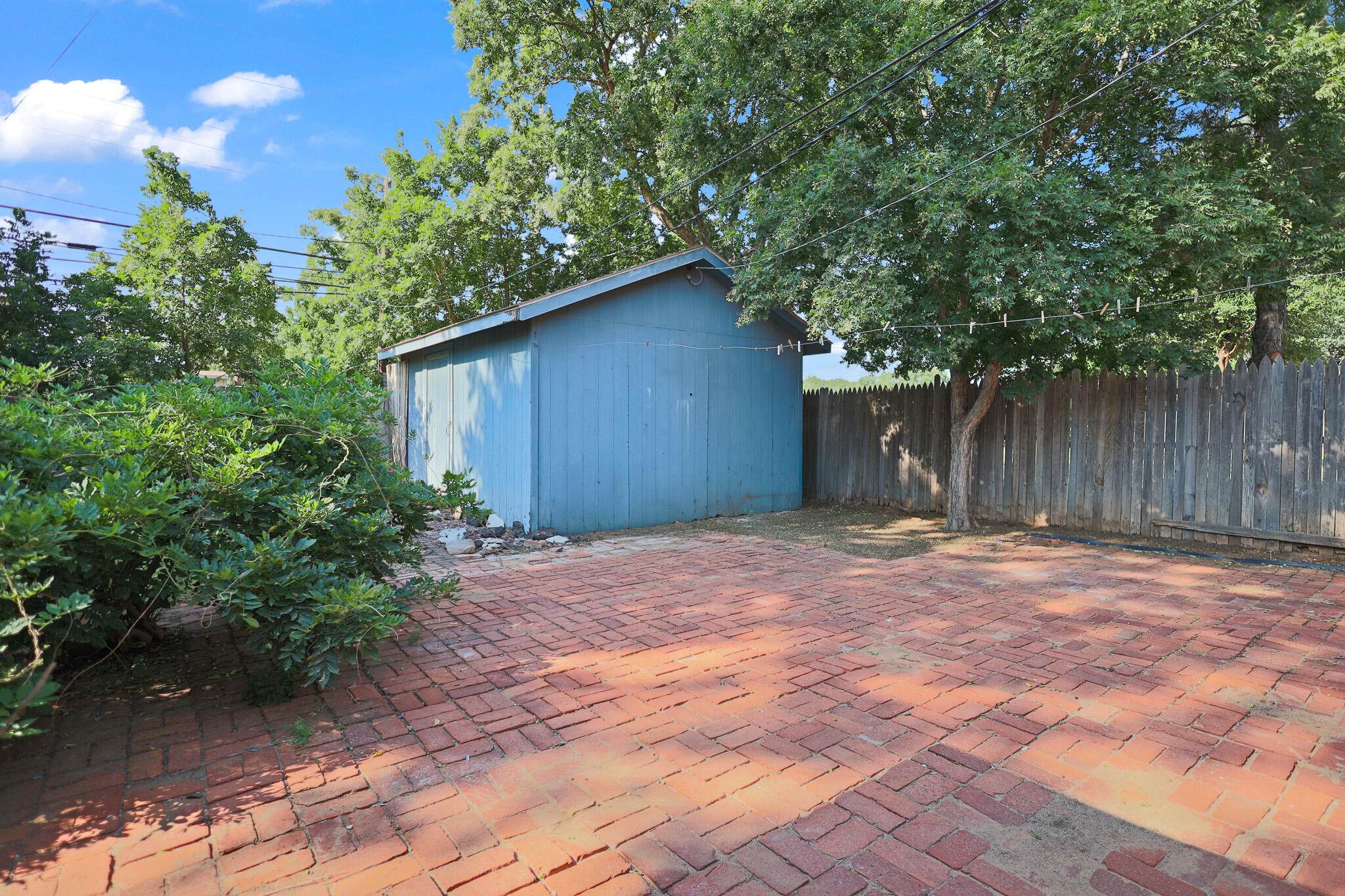 5209 17th Street Lubbock, TX 79416 - Photo 36 of 40 a backyard of a house with lots of green space