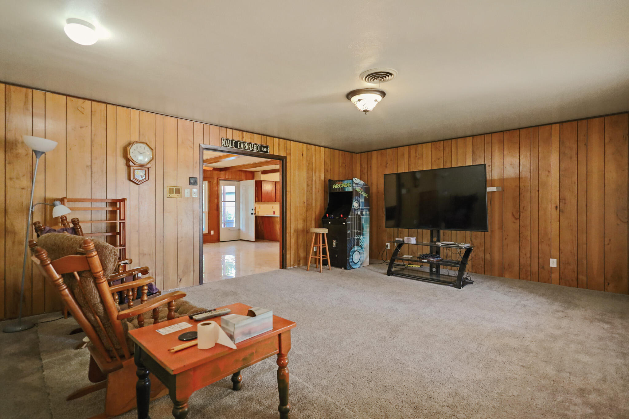 5209 17th Street Lubbock, TX 79416 - Photo 4 of 40 a living room with furniture and a flat screen tv