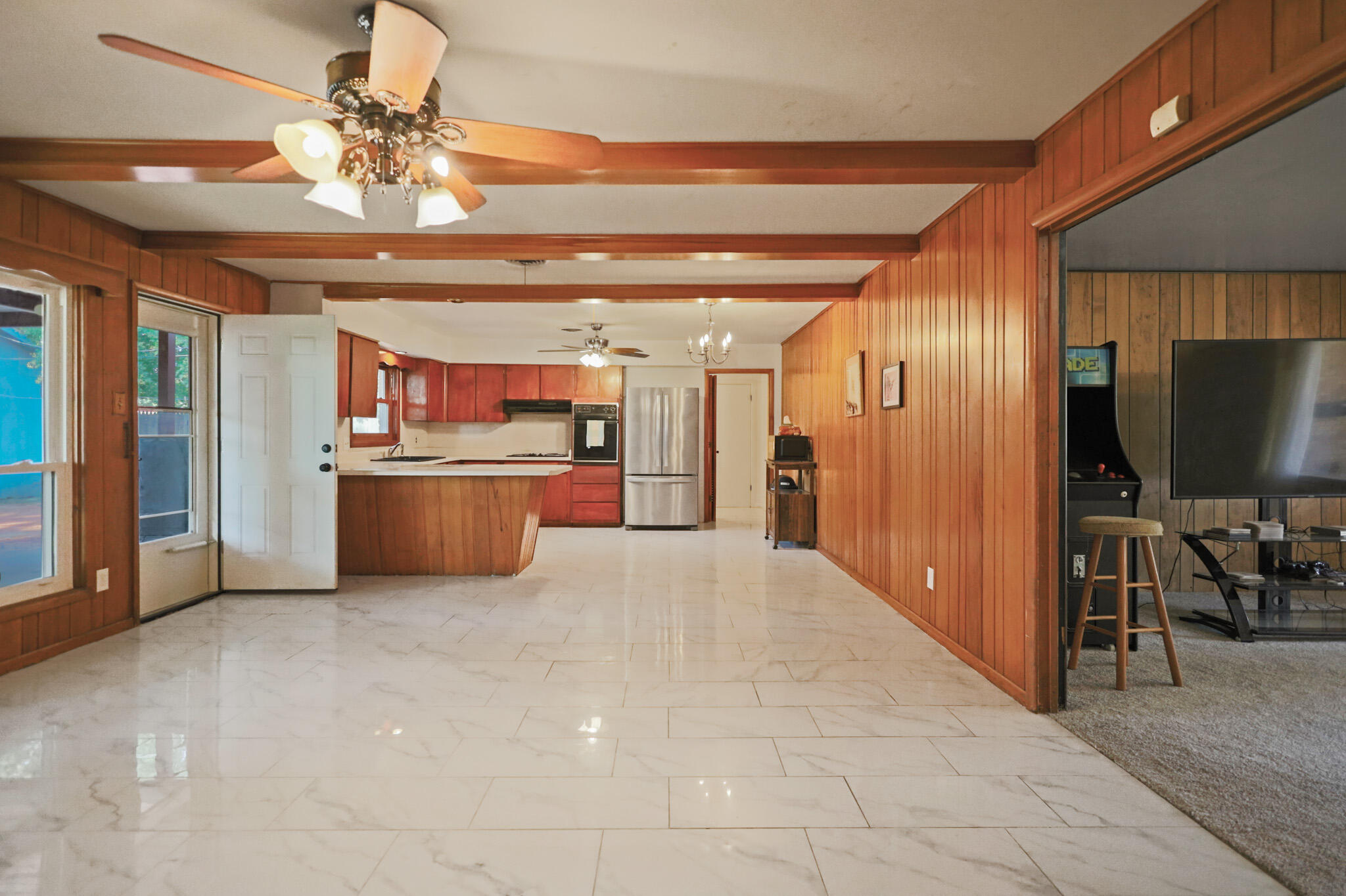 5209 17th Street Lubbock, TX 79416 - Photo 10 of 40 a view of a kitchen with a sink and a refrigerator