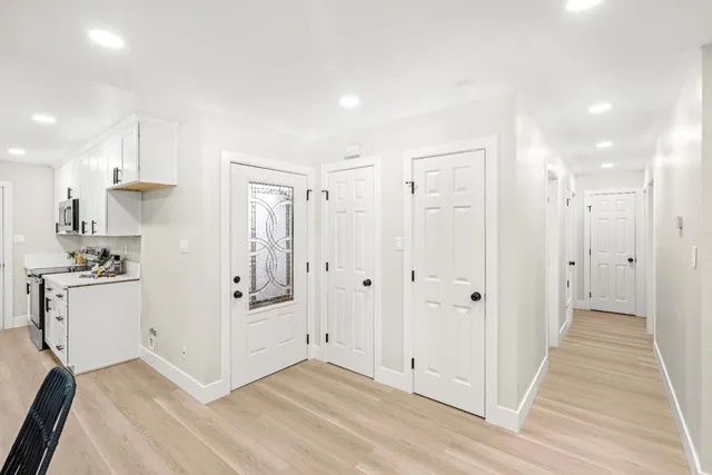a bathroom with a sink a mirror and a shower curtain