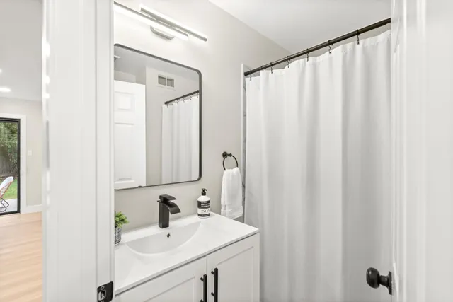 a view of staircase with white walls and a window
