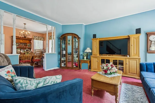 a living room with furniture fireplace and flat screen tv