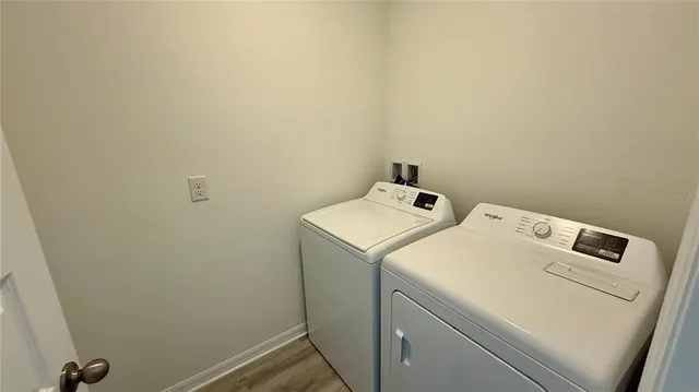a utility room with dryer and washer