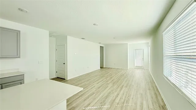 a view of an empty room and window