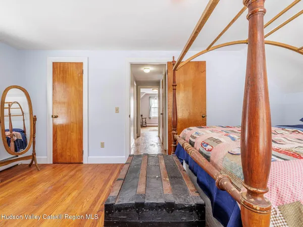 a en suite bathroom with a granite countertop sink