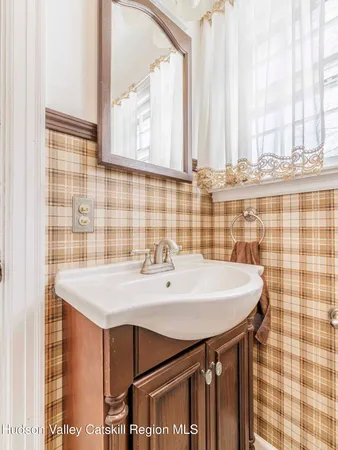 a bathroom with a shower a toilet and a sink