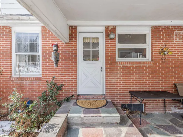 a view of a door with a bench