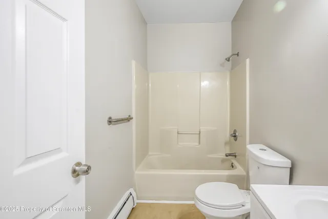 a view of a kitchen with stainless steel appliances granite countertop a sink and cabinets