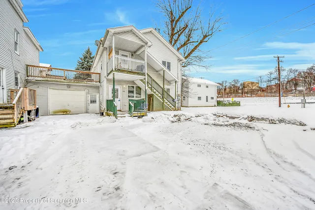 a view of a dry parking space in front of a building
