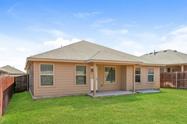 a view of a house with a yard and porch