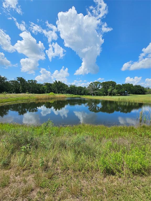 101 Private Road Whitney, TX 76692 - Photo 11 of 30 a view of a lake with houses in the back