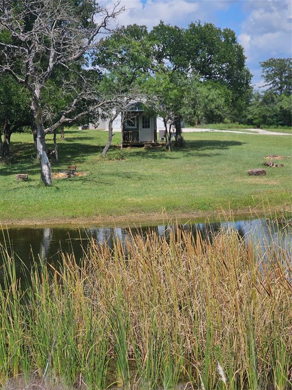 101 Private Road Whitney, TX 76692 - Photo 13 of 30 a view of a green field with wooden fence