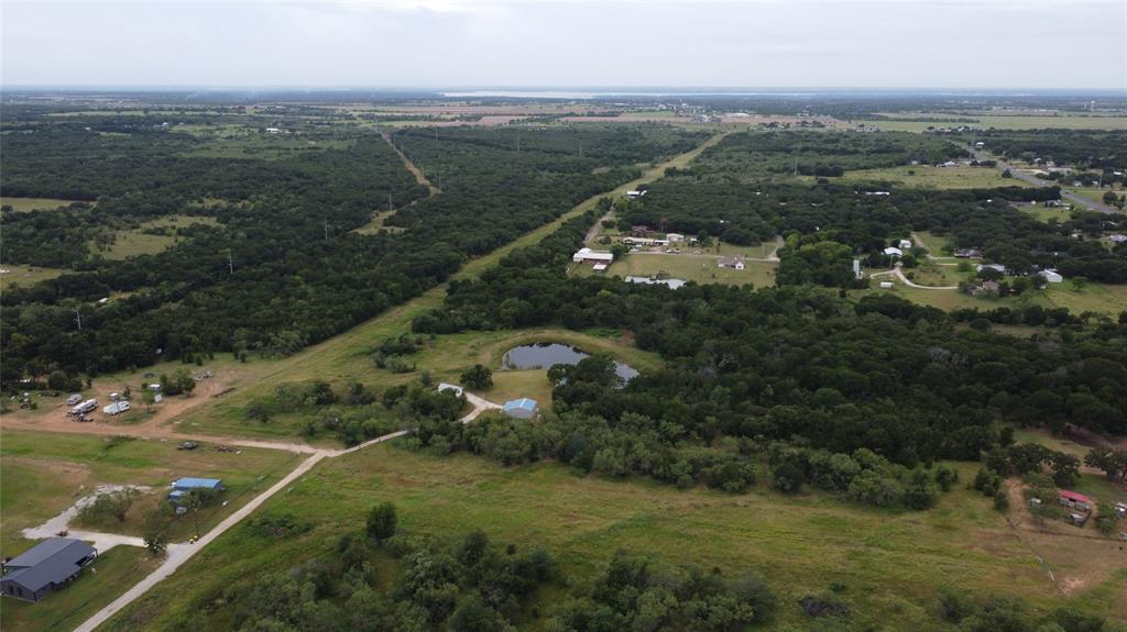 101 Private Road Whitney, TX 76692 - Photo 16 of 30 an aerial view of residential houses with outdoor space and river