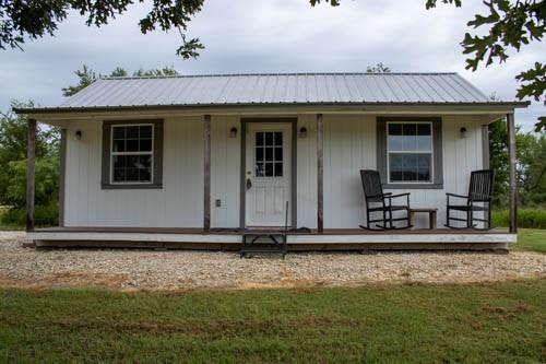 101 Private Road Whitney, TX 76692 - Photo 2 of 30 a front view of a house with garden