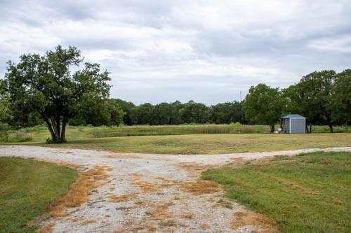 101 Private Road Whitney, TX 76692 - Photo 23 of 30 a view of a golf course with a lake