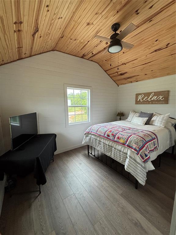 101 Private Road Whitney, TX 76692 - Photo 25 of 30 a bedroom with a bed and a chair