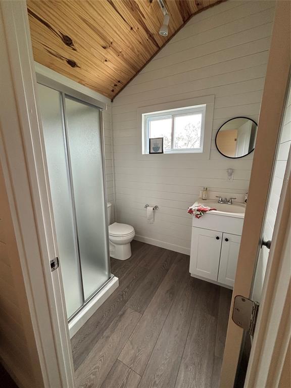 101 Private Road Whitney, TX 76692 - Photo 26 of 30 a bathroom with a sink a toilet a mirror and vanity