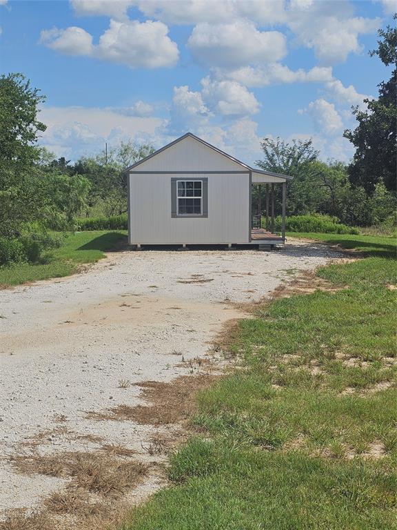 101 Private Road Whitney, TX 76692 - Photo 3 of 30 a big house with a big yard and large trees