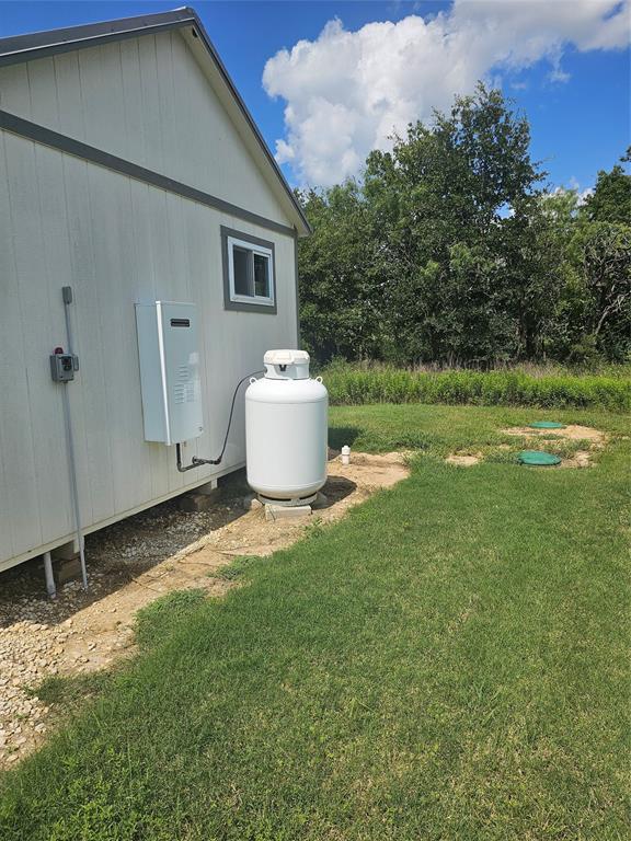 101 Private Road Whitney, TX 76692 - Photo 4 of 30 a house view with a backyard space