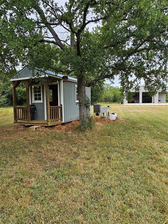 101 Private Road Whitney, TX 76692 - Photo 10 of 30 a view of a house with a yard and large tree