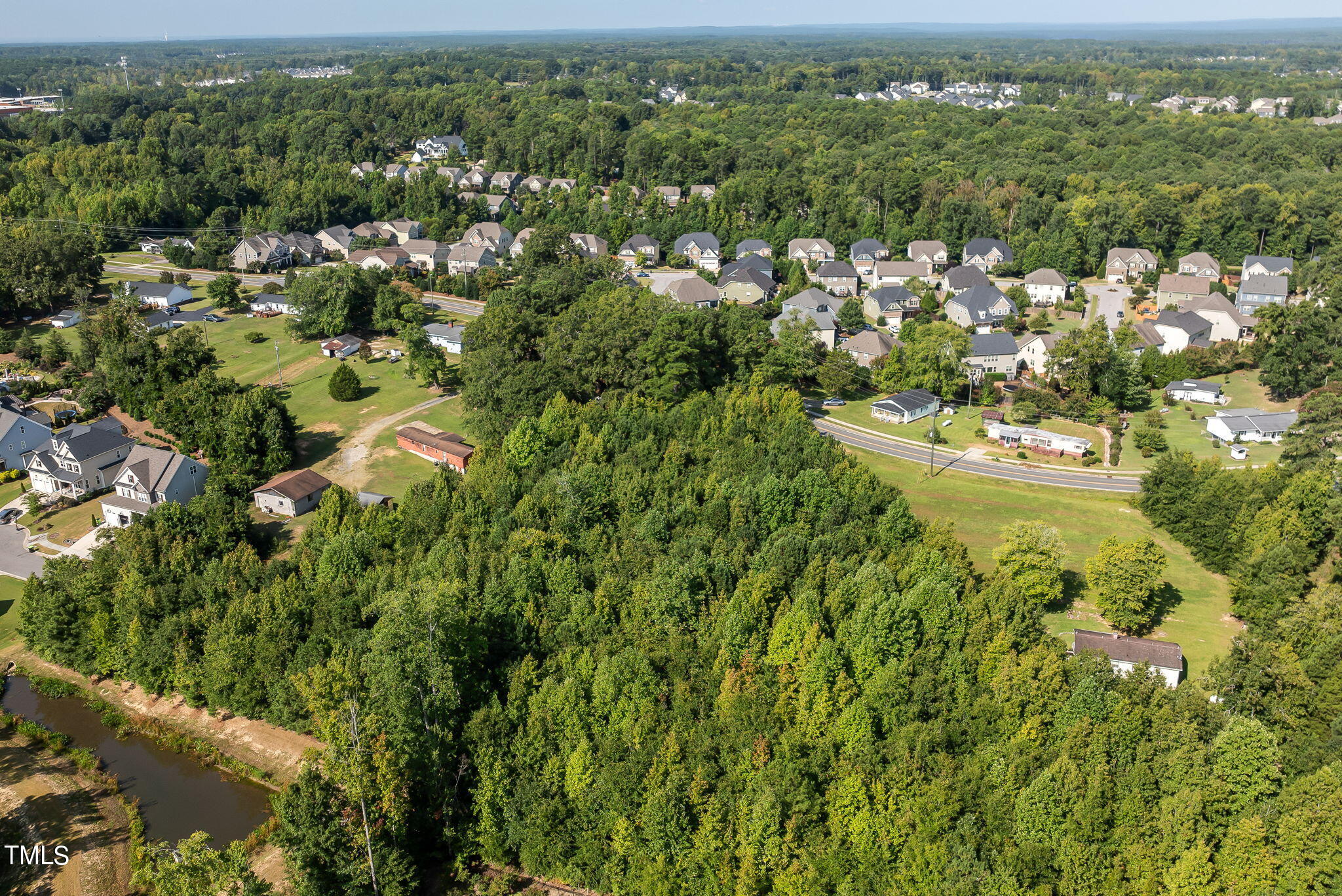 2801 Evans Road Apex, NC 27502 - Photo 6 of 10 an aerial view of residential houses with outdoor space and trees