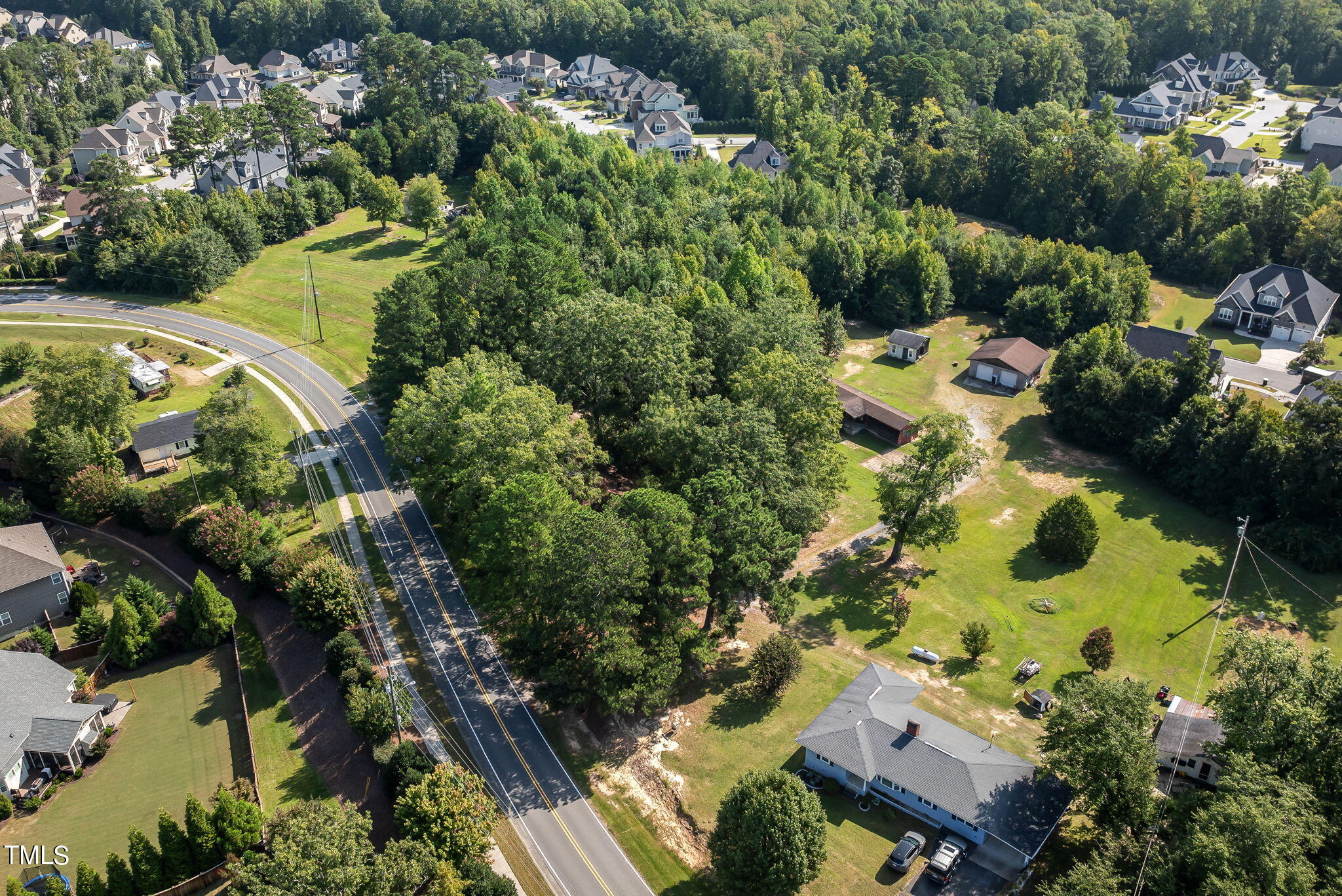 2801 Evans Road Apex, NC 27502 - Photo 9 of 10 an aerial view of residential house with outdoor space and swimming pool