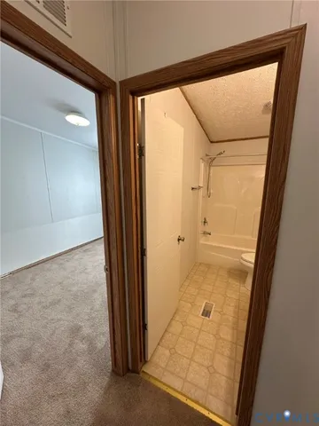 an empty room with a empty space and windows