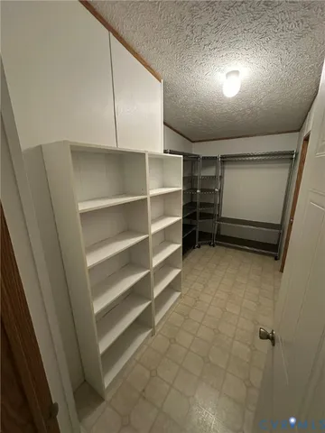 a bath tub sitting next to a white sink