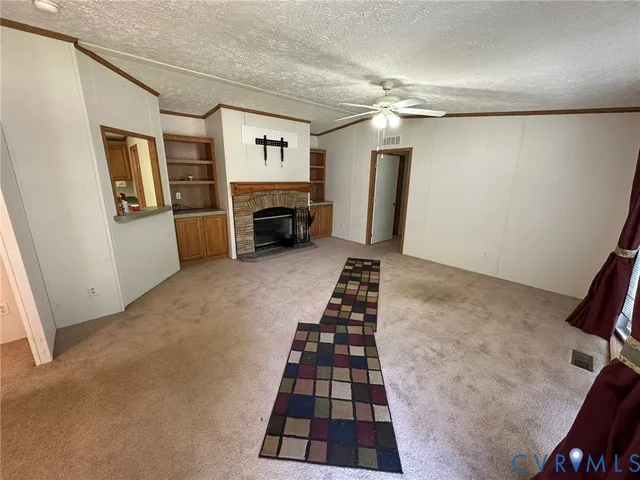 a kitchen with granite countertop a refrigerator and a stove