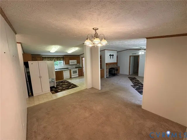 a kitchen with sink refrigerator and cabinets