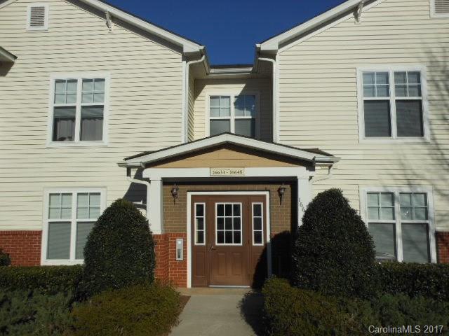 16644 Amberside Road East, Unit E Cornelius, NC 28031 - Photo 1 of 16 a front view of a house with windows and yard