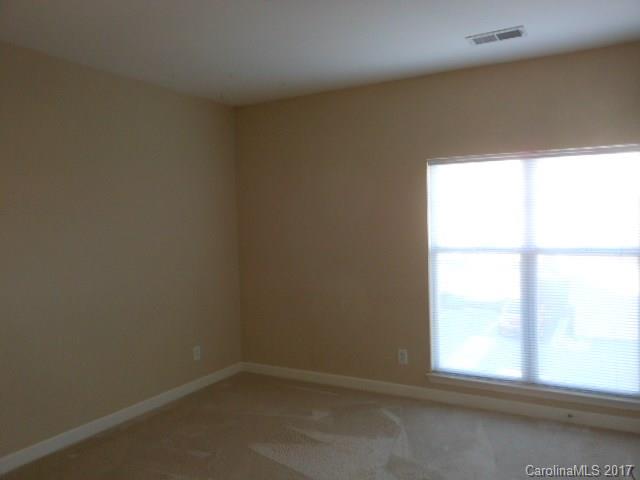 16644 Amberside Road East, Unit E Cornelius, NC 28031 - Photo 13 of 16 an empty room with a window