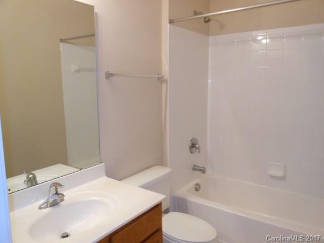 16644 Amberside Road East, Unit E Cornelius, NC 28031 - Photo 15 of 16 a bathroom with a sink toilet and bathtub