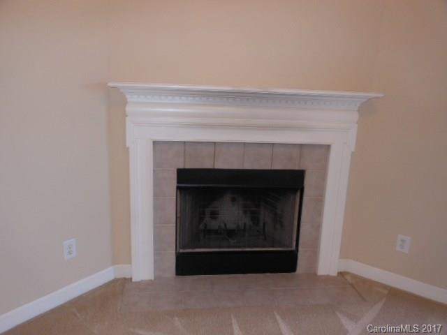 16644 Amberside Road East, Unit E Cornelius, NC 28031 - Photo 8 of 16 a living room with a fireplace