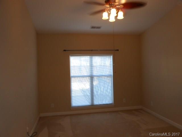 16644 Amberside Road East, Unit E Cornelius, NC 28031 - Photo 9 of 16 an empty room with a window