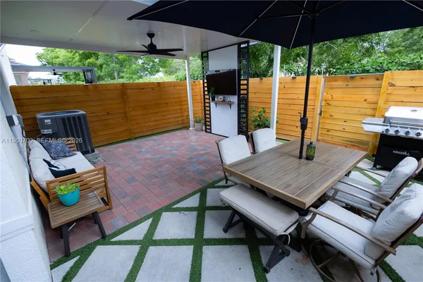 a view of an outdoor sitting area with furniture