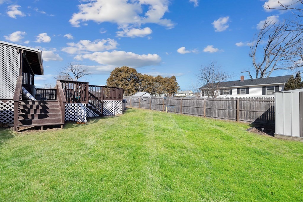 37 Coolidge Road Chicopee, MA 01013 - Photo 27 of 35 a view of a backyard with a garden and deck