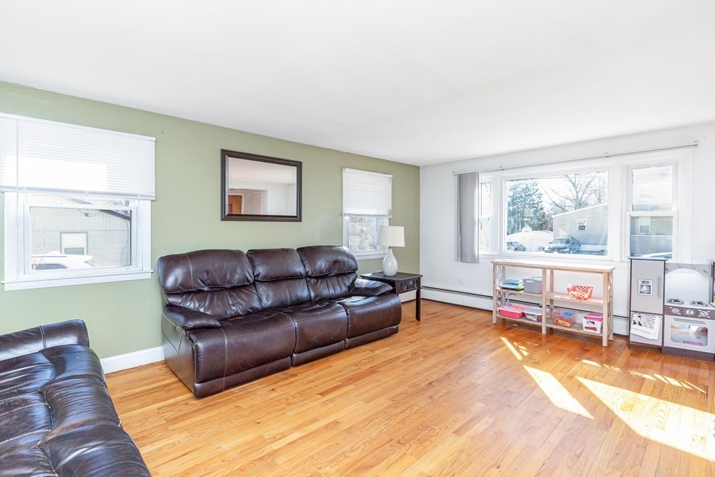 37 Coolidge Road Chicopee, MA 01013 - Photo 4 of 35 a living room with a couch and dresser next to a window