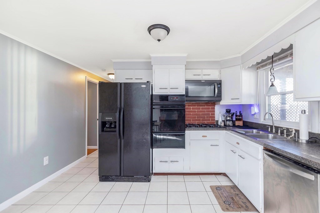 37 Coolidge Road Chicopee, MA 01013 - Photo 9 of 35 a kitchen with stainless steel appliances a refrigerator and a sink