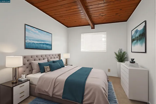 a bedroom with double bed and a potted plant