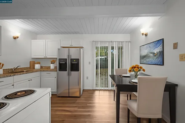 a kitchen that has a cabinets counter space and appliances