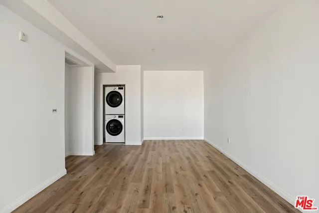 a view of a hallway with washer and dryer