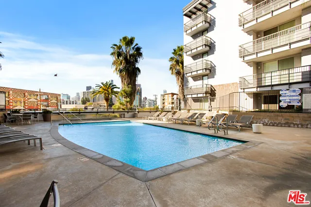 a view of a patio with table and chairs and potted plants