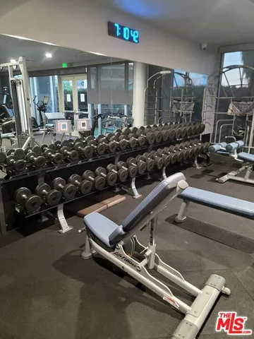 a view of parking garage with cars parked