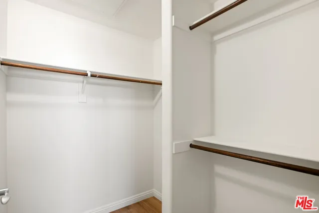 a bathroom with a double vanity sink a toilet and a mirror