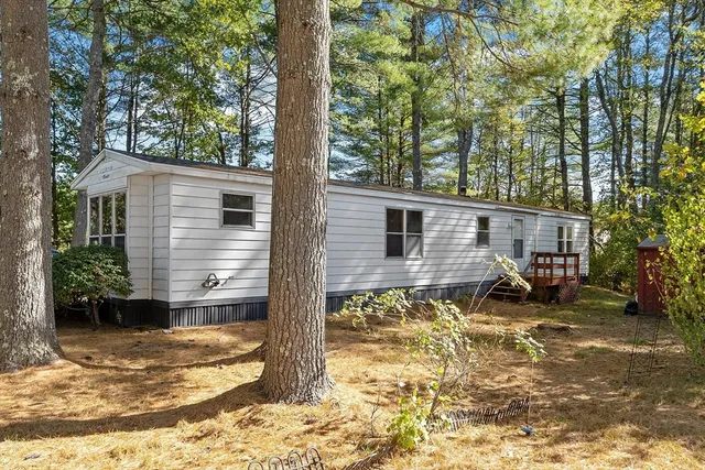 a kitchen with stainless steel appliances granite countertop a stove and a white cabinets